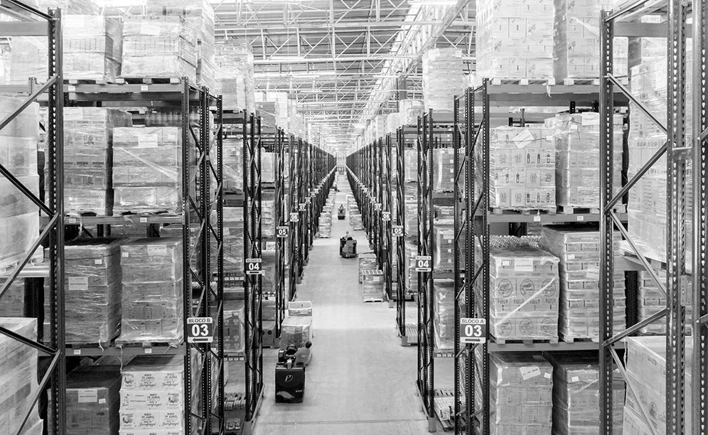 Warehouse racking aisle stocked with palletized goods